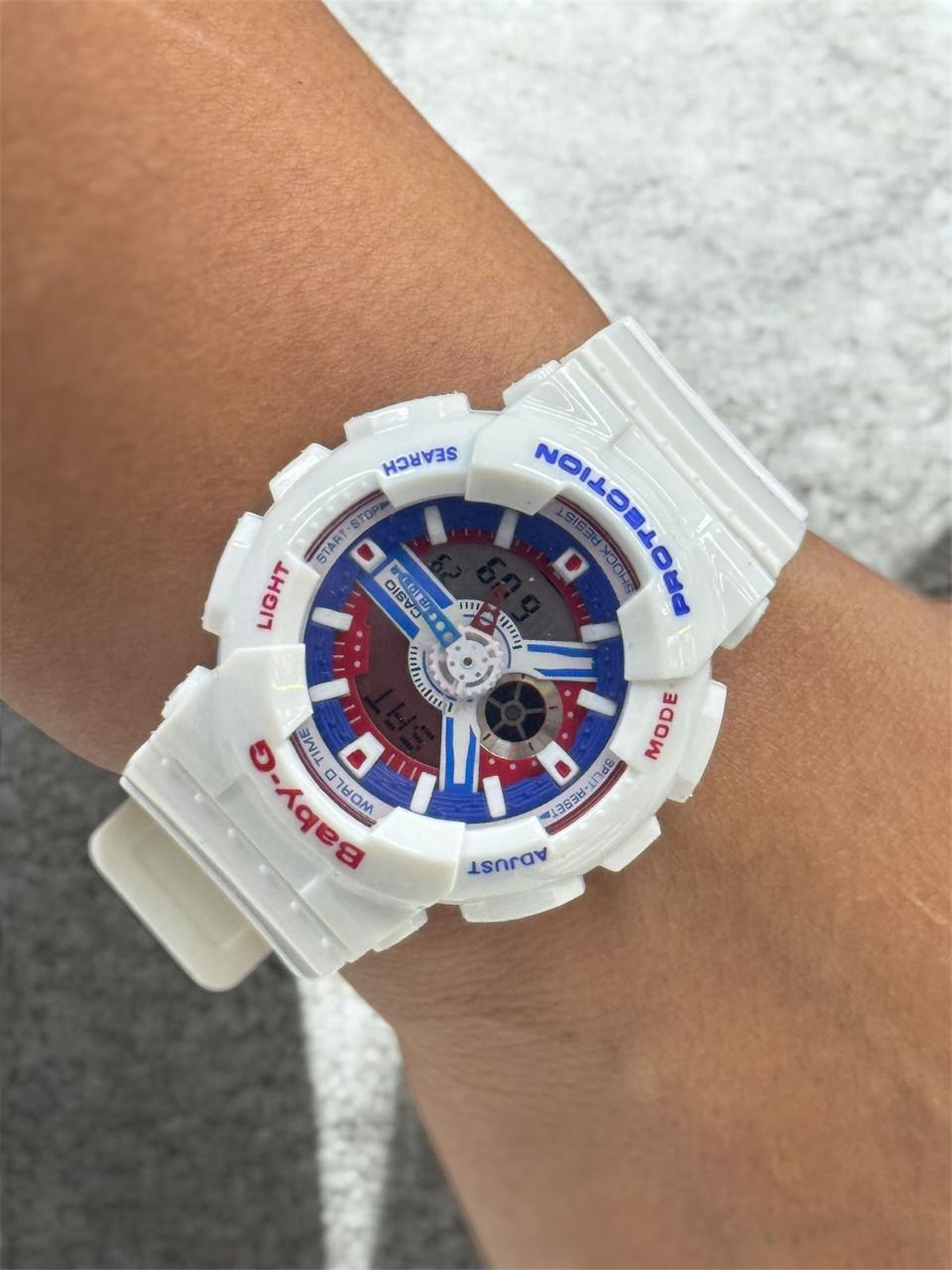 RELOJ BABY G - BLANCO CON AZUL Y ROJO